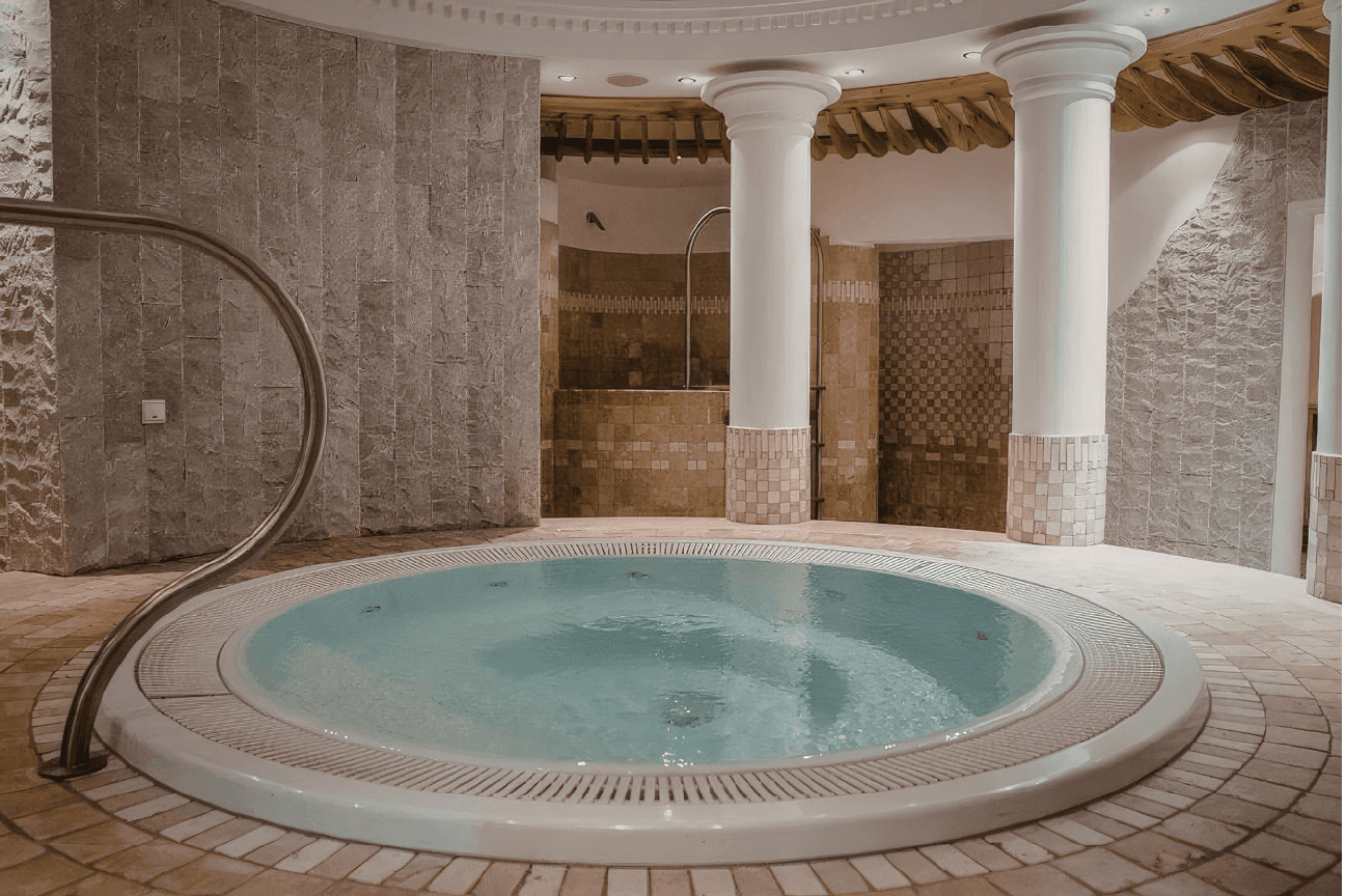 Luxury pool with natural stone and lush vegetation — luxury architecture Costa del Sol