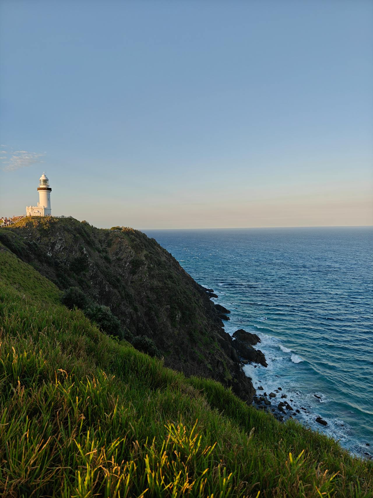Cape Byron Lighthouse overlooking the ocean and cliffs, Byron Bay Australia