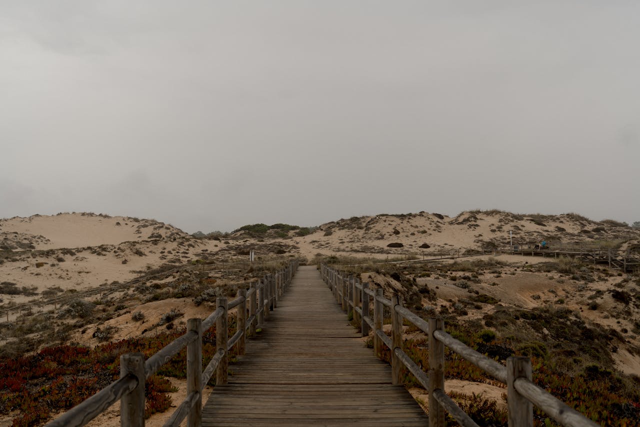 Sandy dunes boardwalk path along the Atlantic coast of Comporta, Portugal
