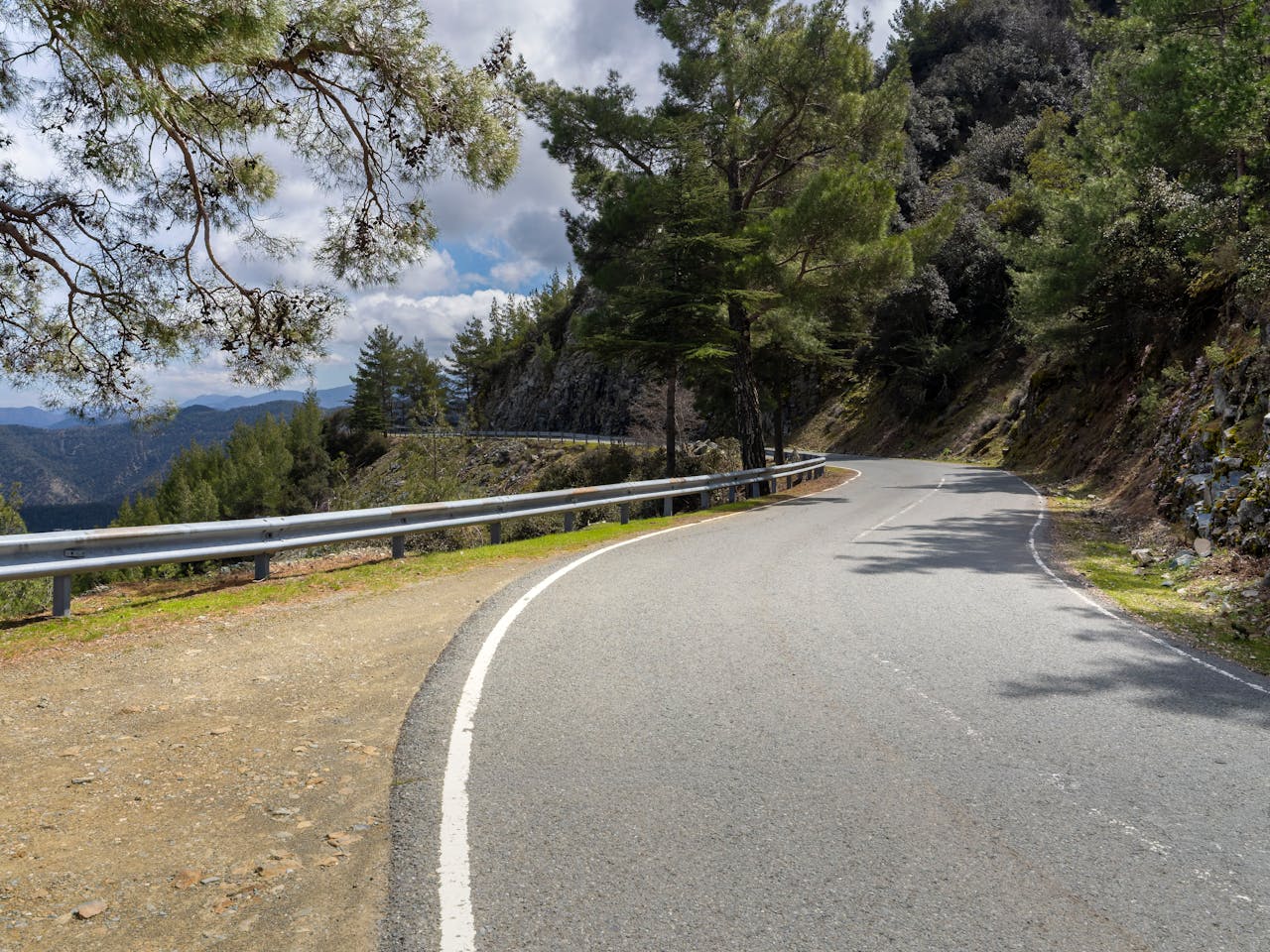 Winding mountain road through Troodos, Cyprus — natural rhythm of the island