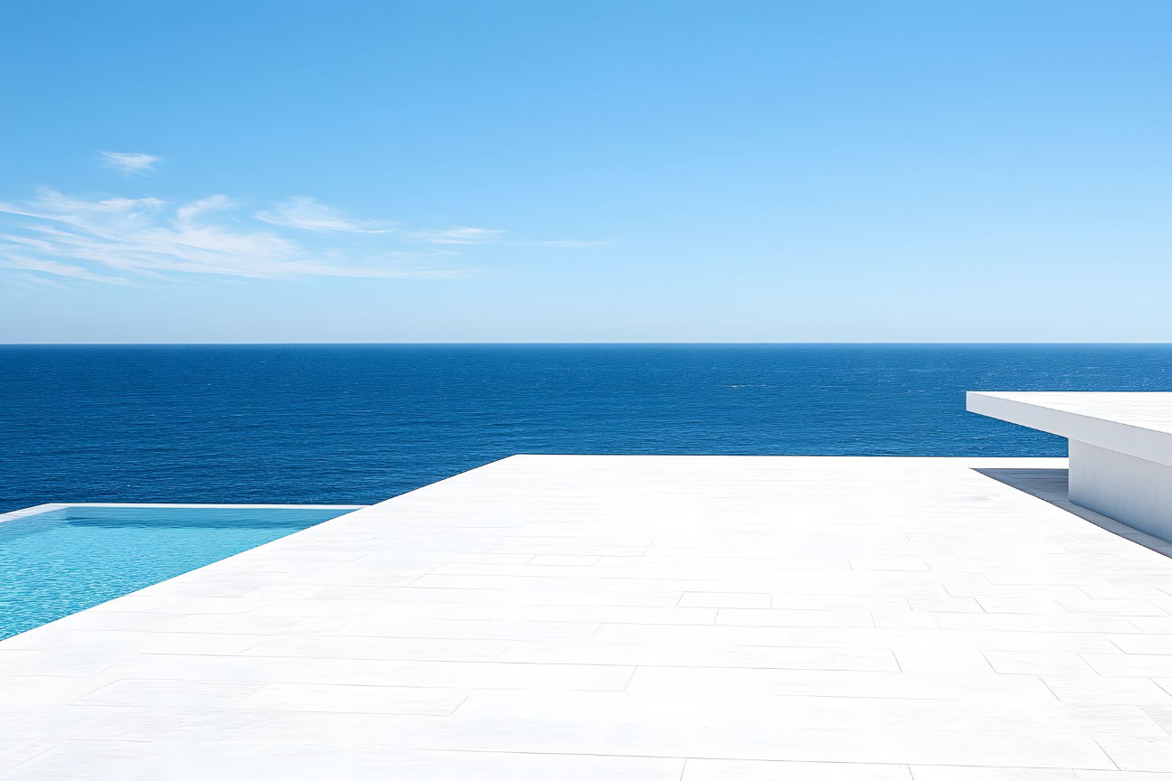 Minimalist white villa with pool and ocean horizon — the Kaluma Way
