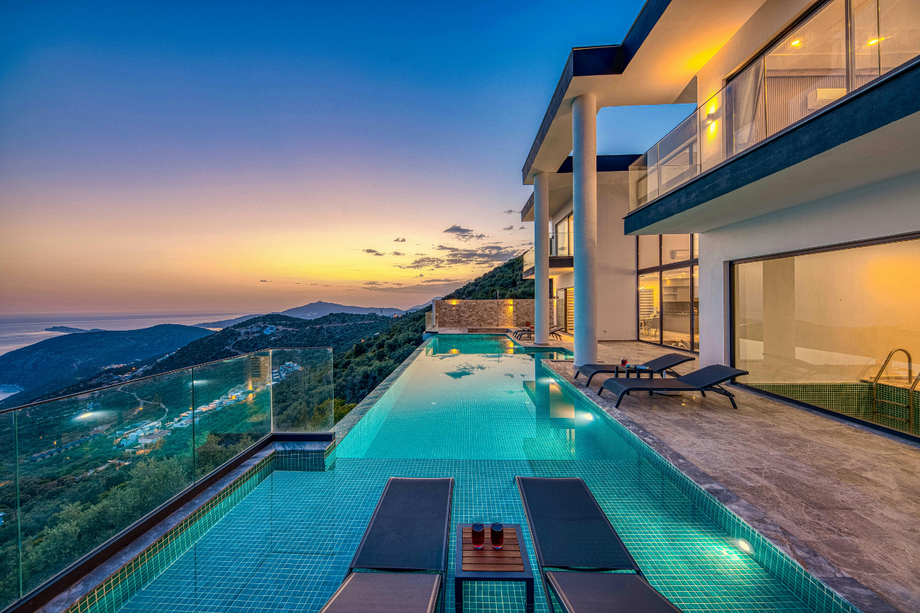 Luxury villa with infinity pool at dusk — The Kaluma Way, Costa del Sol