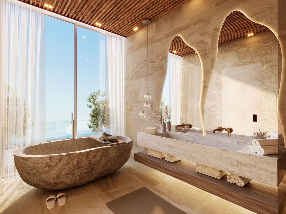 Luxury spa stone bath with sea views and wooden ceiling — private wellness in a Marbella villa