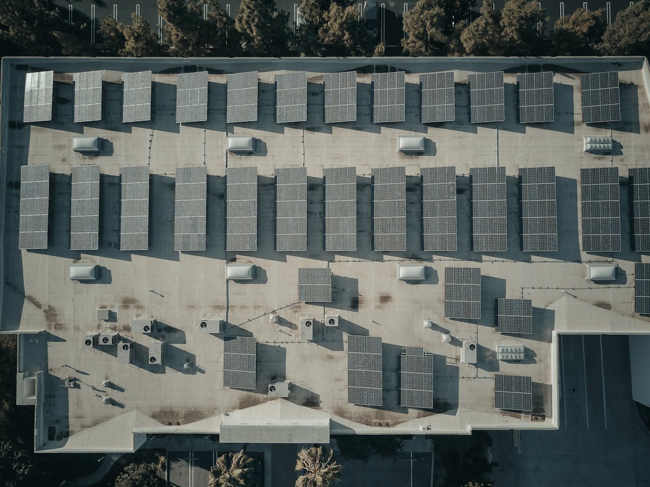 Aerial view of solar panels on roof — aerothermal and energy efficiency in luxury homes