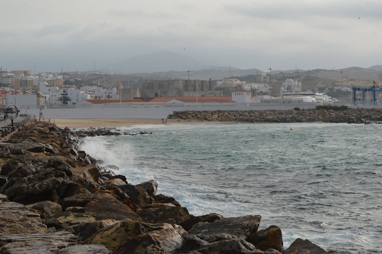 White village architecture integrated into the wild Tarifa landscape — Costa de la Luz Cádiz