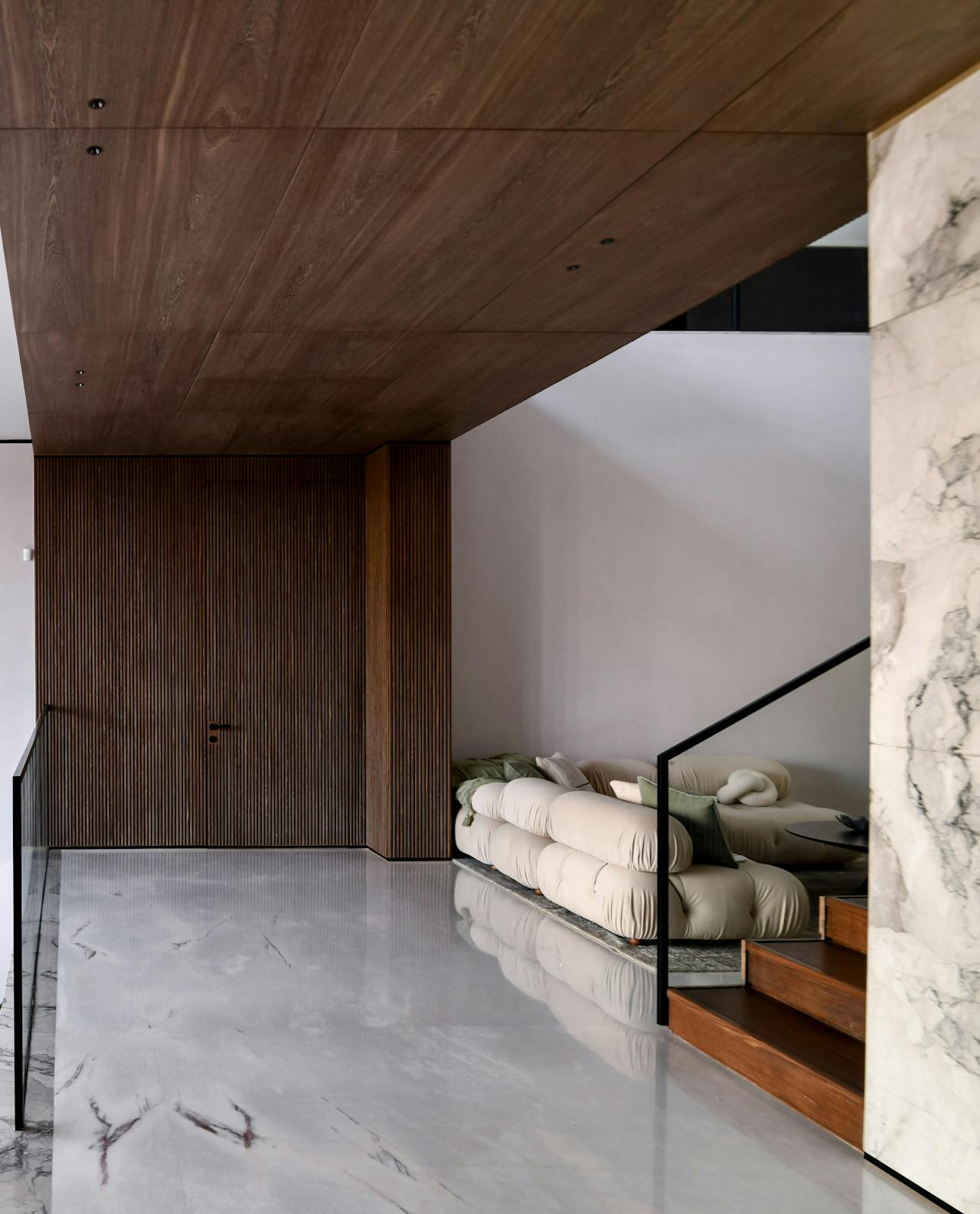 Luxury minimalist interior with marble and wood elements — spatial architecture precision