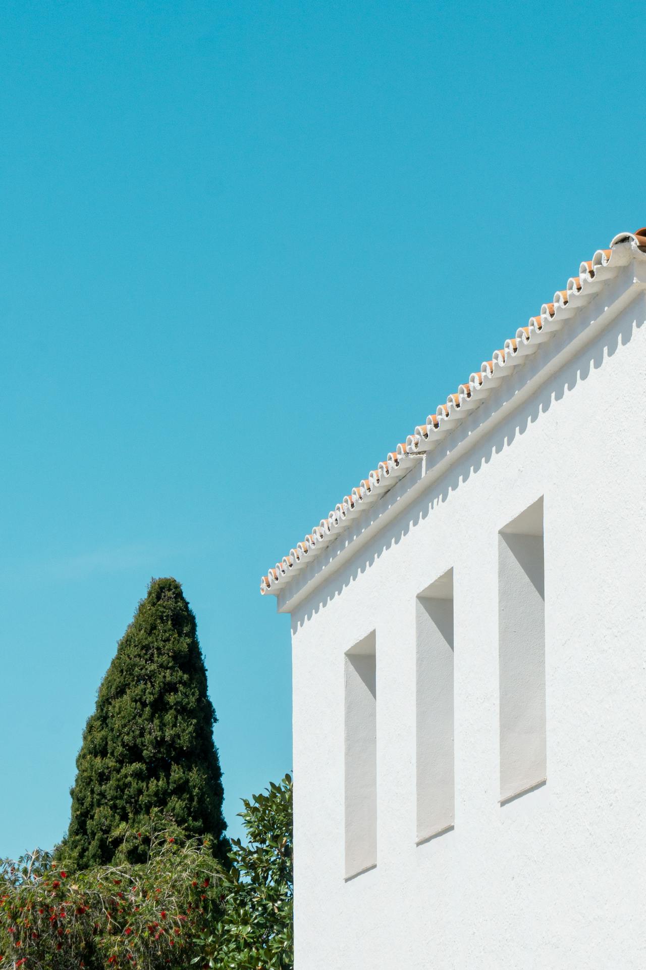Minimalist white Mediterranean architecture — clean geometric lines, Nerja Spain