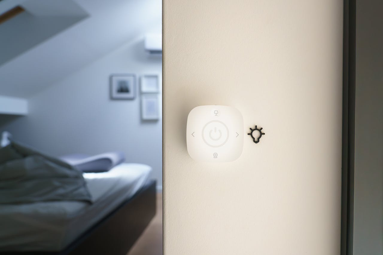 Minimalist bedroom with invisible smart home control — technology integrated in luxury interior design